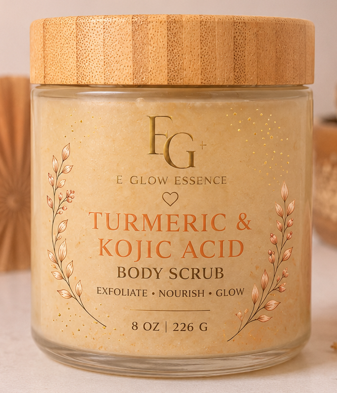 E Glow Essence Turmeric & Kojic Acid Body Scrub jar with decorative elements on a light background